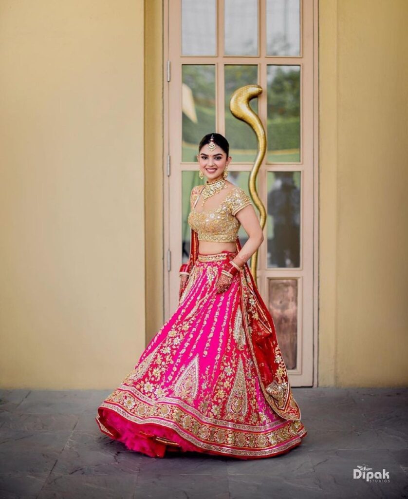 pink bridal lehenga with golden choli 