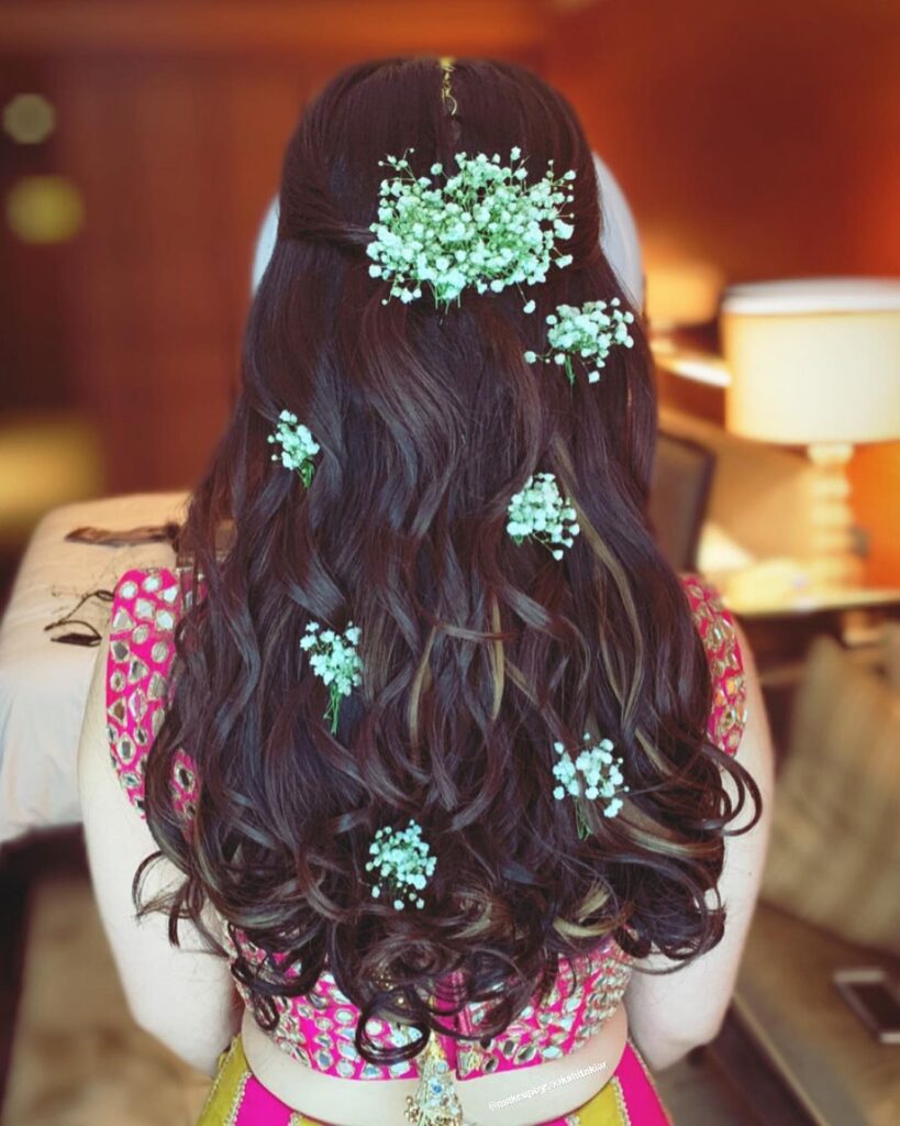 Mehendi Bridal hairstyle With Flowers