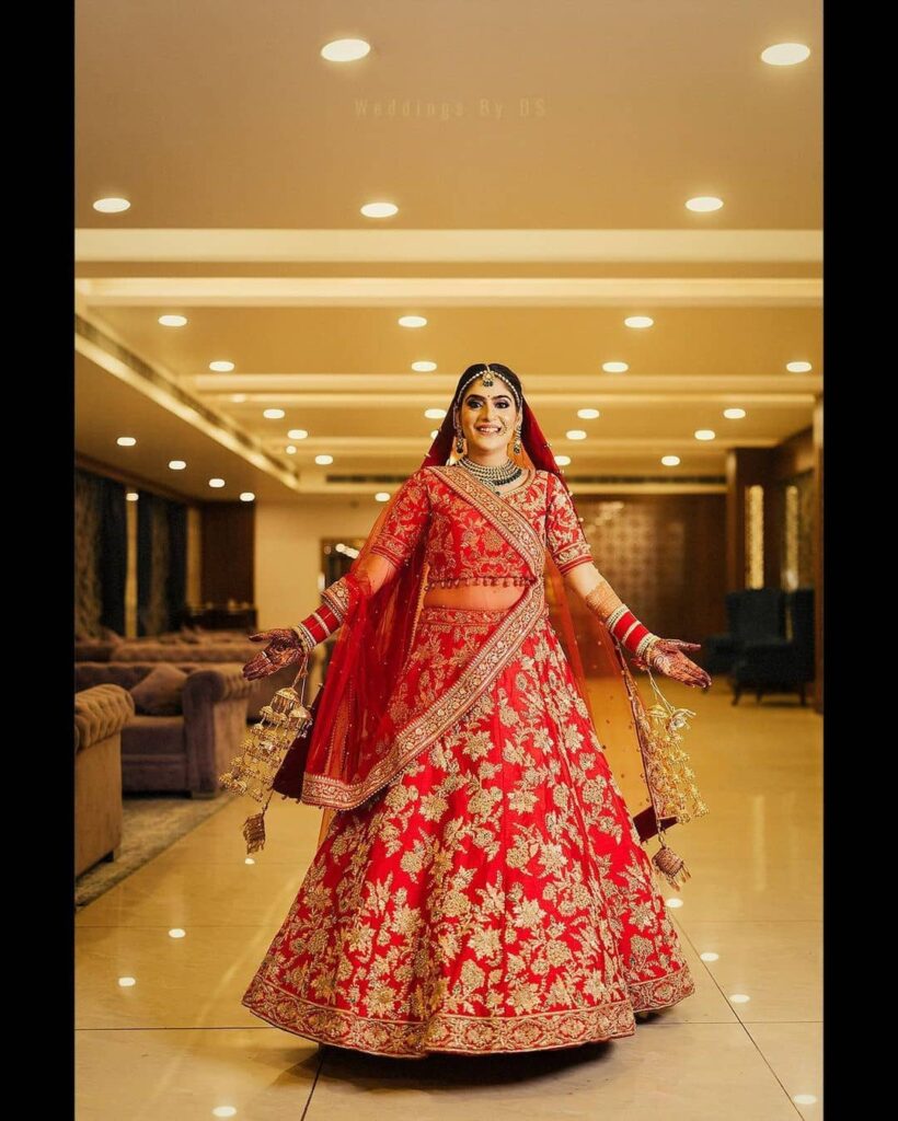 Red embroidered lehenga with contrast pink dupatta – Aayushi Pathania Jaipur