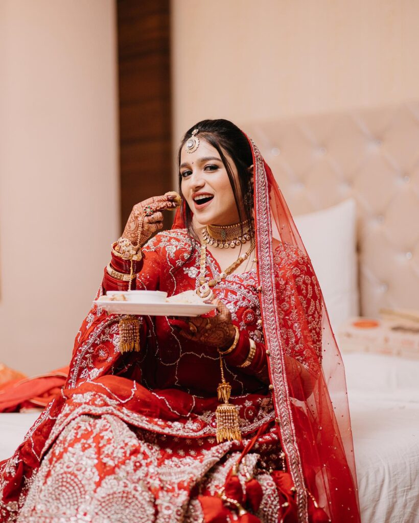 Red Bridal Lehenga With Golden Jewelry