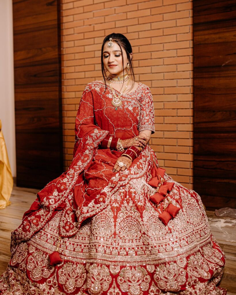 Red Bridal Lehenga With Golden Jewelry